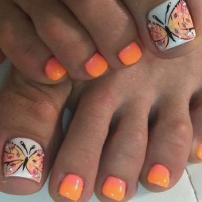 The big toe of a person showcases a complete butterfly design, while the remaining four toes are painted in orange color.